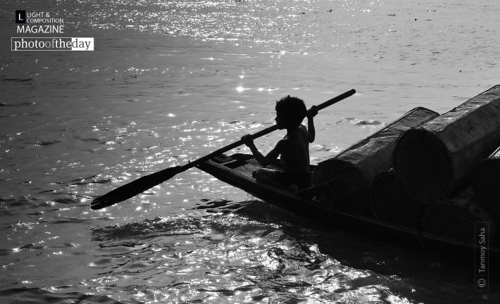 A Little Soul and His Boat, by Tanmoy Saha A Little Soul and His Boat, by Tanmoy Saha - Photojournalism, Black and White Photography, Photography Awards, Art Photography, Online Photography Courses