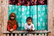 Brother and Sister at the Window by Zain Abdullah - Candid Photography, Photojournalism, Photography Education, Art Photography, Online Photography Courses