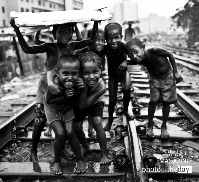Playing in Monsoon Dhaka by Jan Møller Hansen Playing in Monsoon Dhaka by Jan Møller Hansen - Photojournalism, Street Photography, Documentary Photography, Black and White Photography, Dhaka