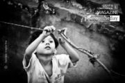Kid Ties a Knot, by Swaroop Singha Roy - Candid Photography, Photojournalism, Child Photography, Street Photography, Award Winning Photo