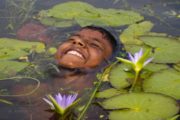 Float like a Lily Flower, by Shahnaz Parvin - Photojournalism, Candid Photography, Documentary Photography, Award-Winning Photography, Photo of the Day