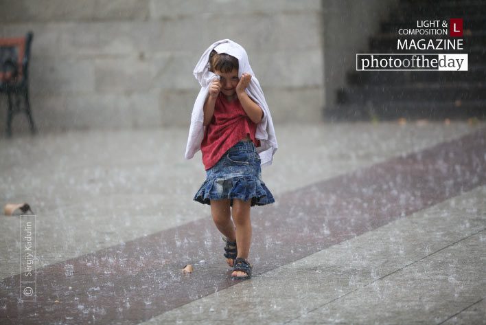 Running in the Rain by Sergiy Kadulin Running in the Rain by Sergiy Kadulin - Travel Photography, Photojournalism, Photography Awards, Art Photography, Online Photography Courses