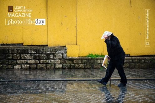 Rhythm in the Rain, by Mohammad Saiful Islam - Street Photography, Photojournalism, Photography Awards, Photo of the Day, Online Photography Courses