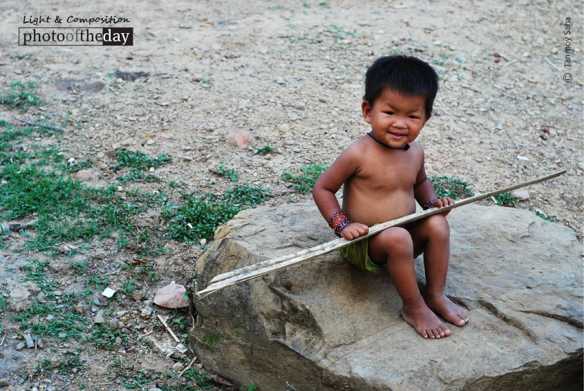 A Happy Tribal Kid, by Tanmoy Saha A Happy Tribal Kid, by Tanmoy Saha - Portrait Photography, Award Winning Photography, Photojournalism, Documentary Photography, Tribal Photography