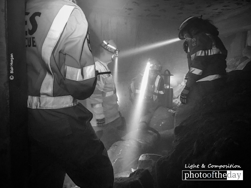 Light in Darkness, by Blair Horgan Light in Darkness, by Blair Horgan - Photojournalism, Black and White Photography, Photo of the Day, Award Winning Photography, Photography Education