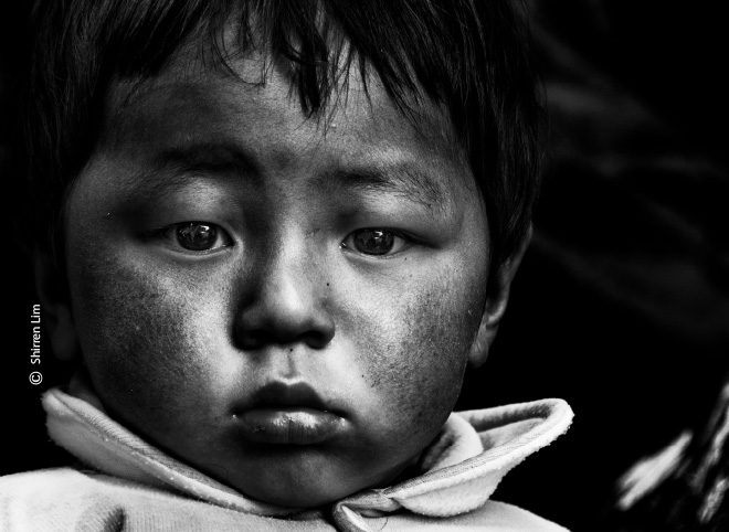 Stuck in the Mirror, by Shirren Lim Stuck in the Mirror, by Shirren Lim - Candid Photography, Photojournalism, Award Winning Photography,  Bhutan, Shirren Lim