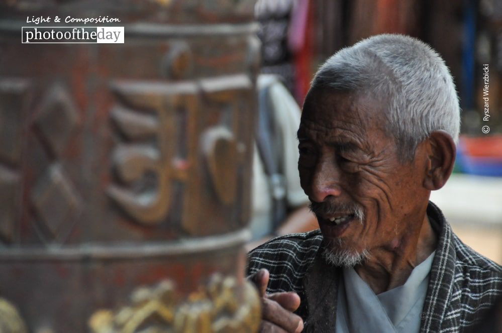 A Pilgrim at Boudhanath, by Ryszard Wierzbicki A Pilgrim at Boudhanath, by Ryszard Wierzbicki - Photojournalism, Candid Photography, Photography Awards, Photo of the Day, Ryszard Wierzbicki
