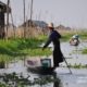 A Rower at the Floating Village, by Ryszard Wierzbicki - Travel Photography, Photojournalism, Art Photography, Photography Awards, Ryszard Wierzbicki