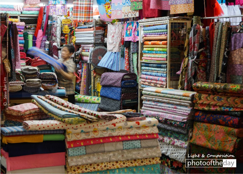 Arranging Stock, by Siew Bee Lim Arranging Stock, by Siew Bee Lim - Color Photography, Photo of the Day, Award Winning Photography, Photography Awards, Siew Bee Lim