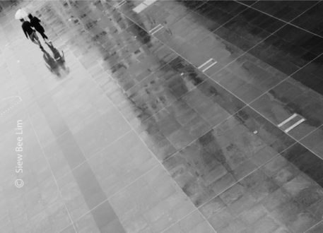 Sharing an Umbrella, by Siew Bee Lim - Minimalist Photography, Photo of the Day, Photography Awards, Online Photography Courses, Art Photography