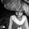 The Girl with a Bundle by Lavi Dhurve - Award-Winning Photography, Art Photography, Portrait Photography, Photo of the Day, Light & Composition University