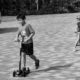 Playing Push Scooter by Siew Bee Lim - Street Photography, Photo of the Day, Photography Awards, Art Photography, Online Photography Courses
