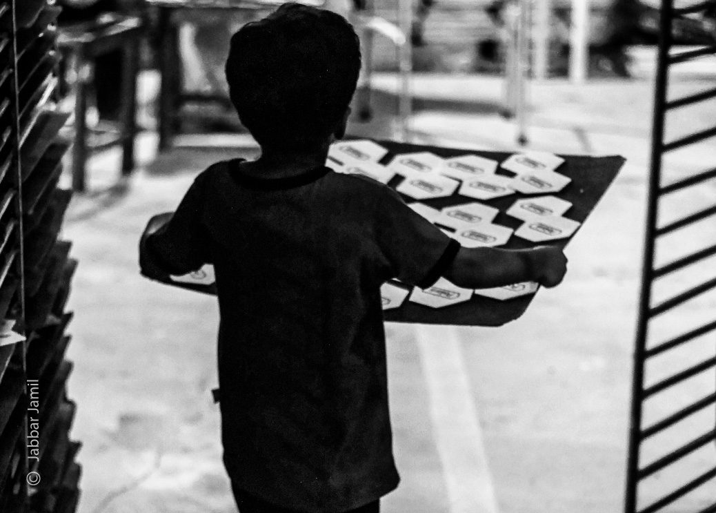 Little Helper by Jabbar Jamil - Documentary Photography, Photojournalism, Photography Awards, Award Winning Photo, Black and White Photography