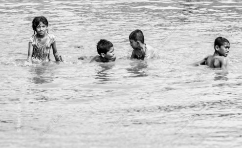 Four Children Playing in the River