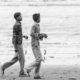 Boys Carrying Crabs Along the Shore