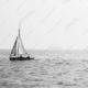 Sailboat on a Hazy Sea