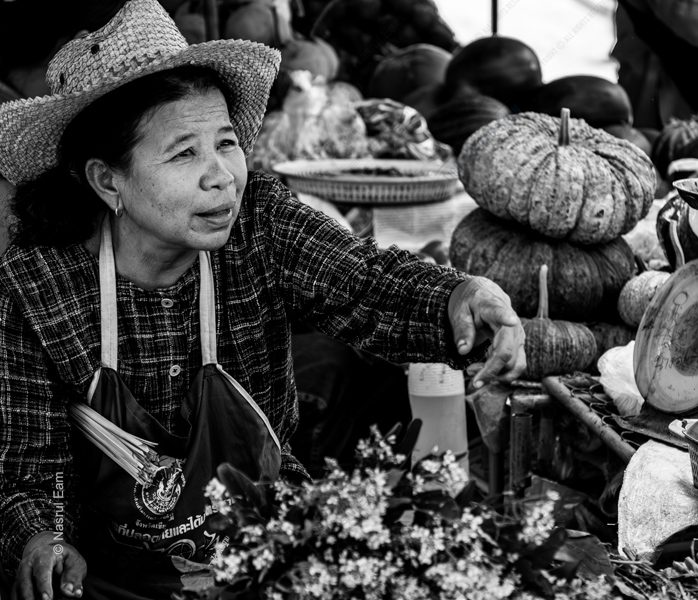 Market Vendor with Woven Hat and Pumpkins - Black and white photography, documentary photography, portrait photography, fine art photography, Nasrul