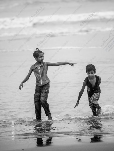 The Pointing Girl at the Water's Edge The Pointing Girl at the Water's Edge - Fine Art Photography Prints, Limited Edition Photography, Giclée Print, Black and White Photography, Art Photography Investment
