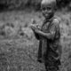 Young Boy with Clasped Hands in a Field - Fine Art Photography Print, Limited Edition Photography, Black and White Portrait, Giclée Print, Fine Art Photography