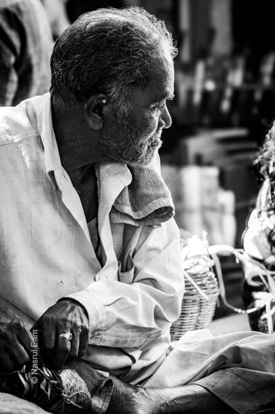 The Seated Vendor in Profile The Seated Vendor in Profile - Fine Art Photography Print, Limited Edition Photography, Black and White Photography, Museum-Quality Print, Art Photography for Sale