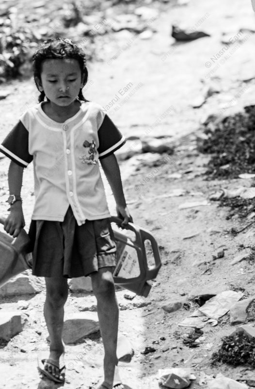 Young Girl with Water Canisters Young Girl with Water Canisters