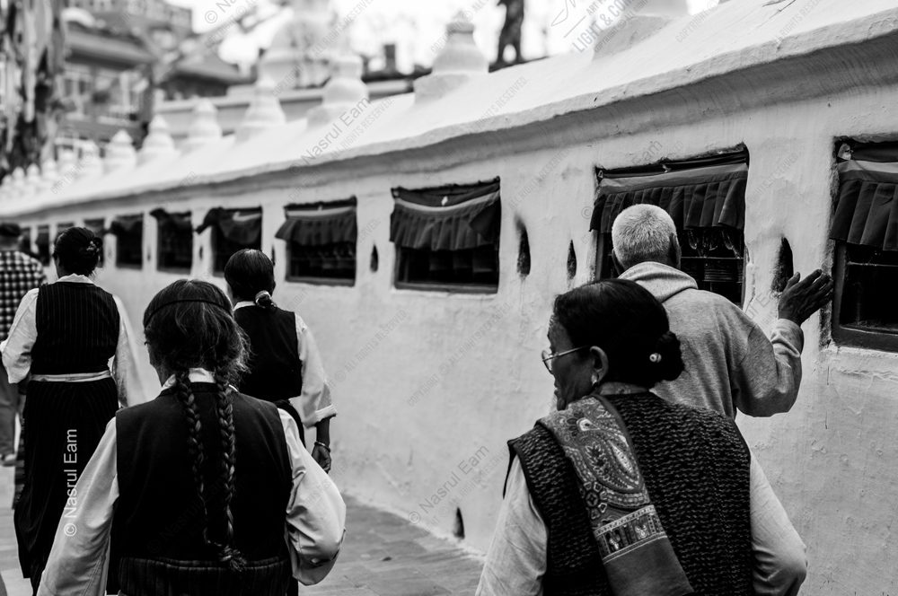 Procession by the Whitewashed Stupas