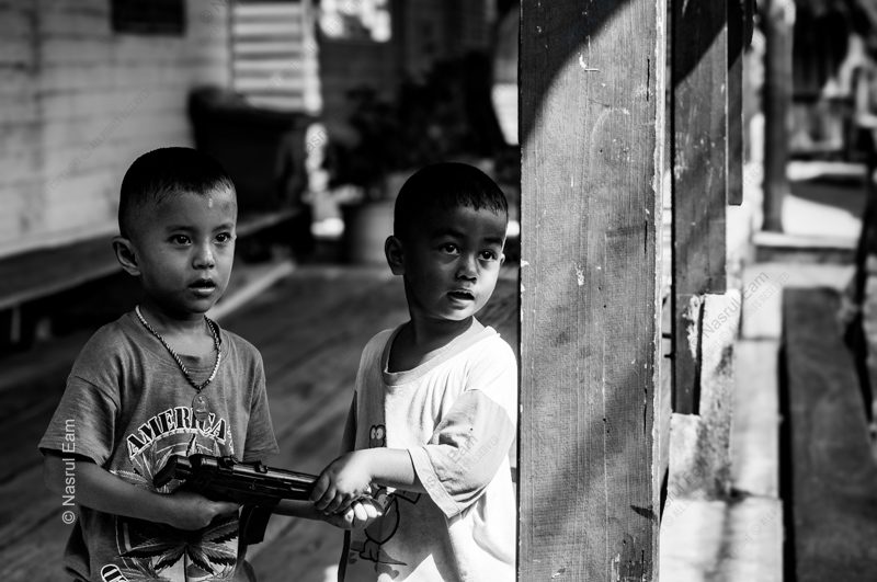 Two Boys with a Toy Rifle - Fine Art Photography Print, Limited Edition Photography, Black and White Photography,  Giclée Print,  Contemporary Art Photography