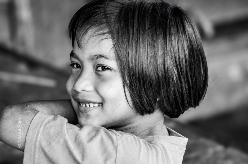 A Young Girl's Smile Over Her Shoulder A Young Girl's Smile Over Her Shoulder - Fine Art Photography Print, Limited Edition Photography, Giclée Print, Museum-Quality Photography, Art Photography Investment