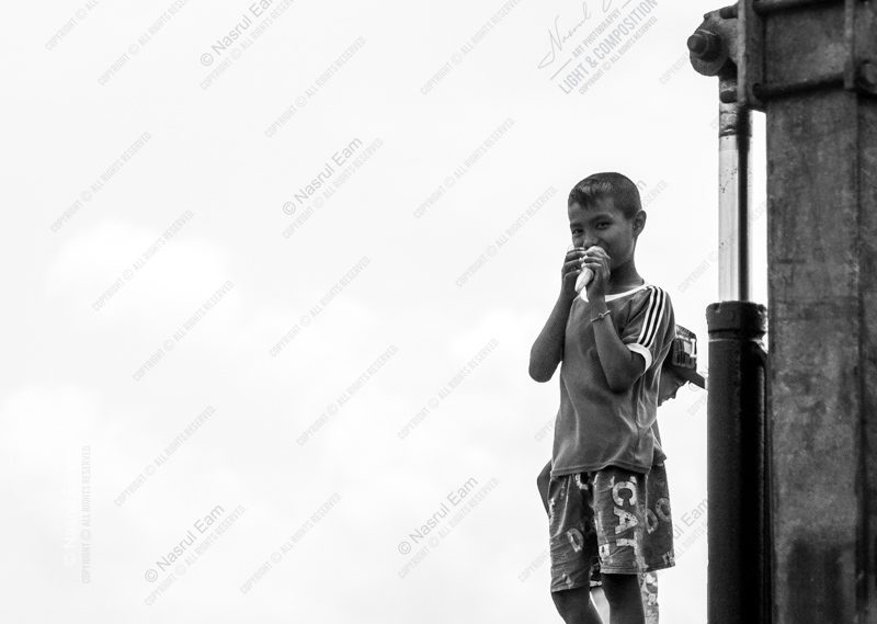 Boy with a Treat by the Steel Post Boy with a Treat by the Steel Post - Fine Art Photography Print, Limited Edition Photography, Giclée Print, Monochrome Photography, Art Photography