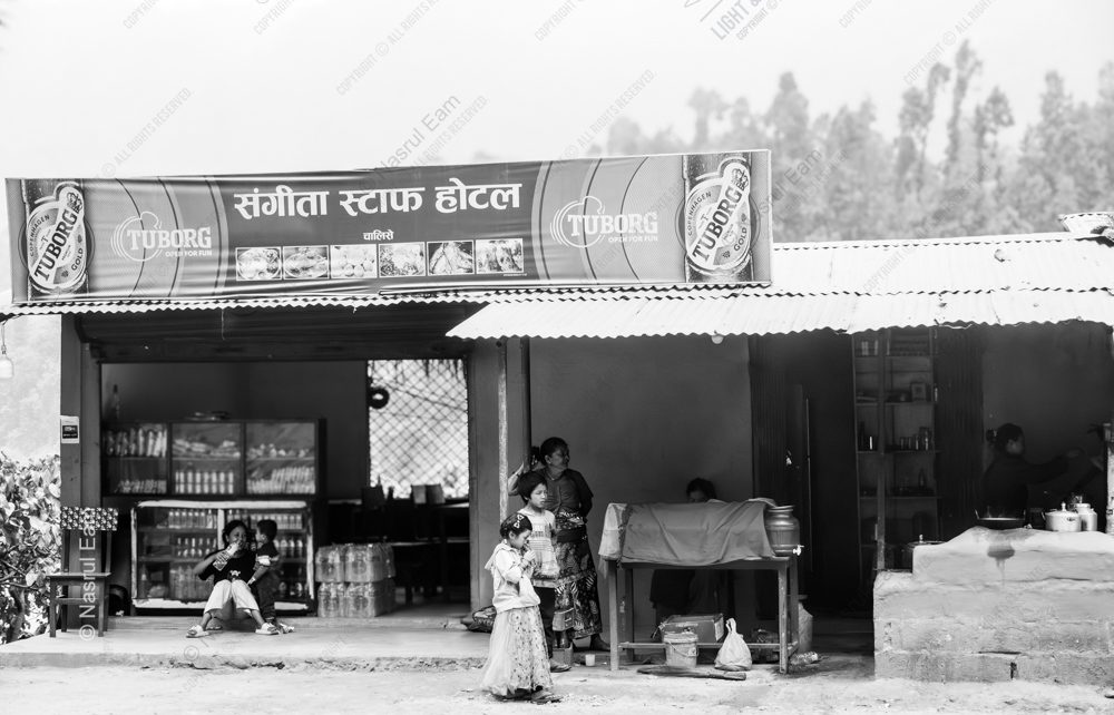 Roadside Life: Children and Women at the Hotel Front