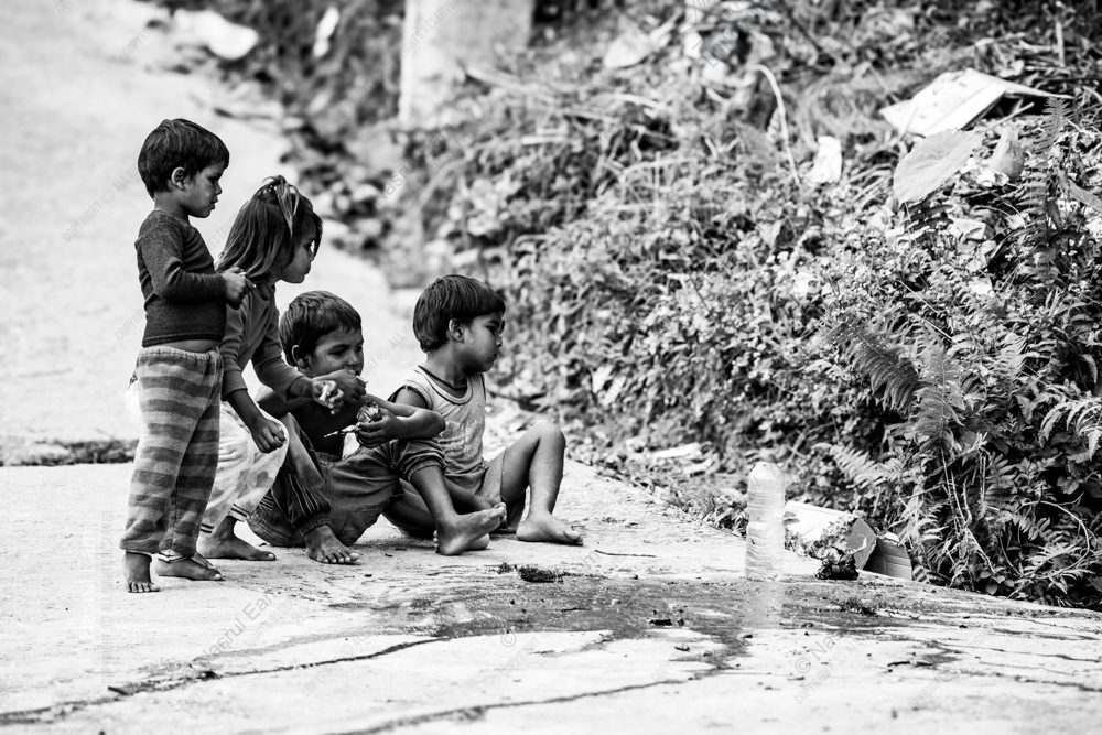 Barefoot Children by the Roadside, Absorbed in the Moment