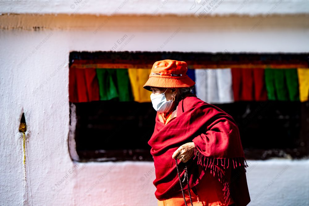 Crimson Contemplation: A Masked Devotee's Enduring Spirit