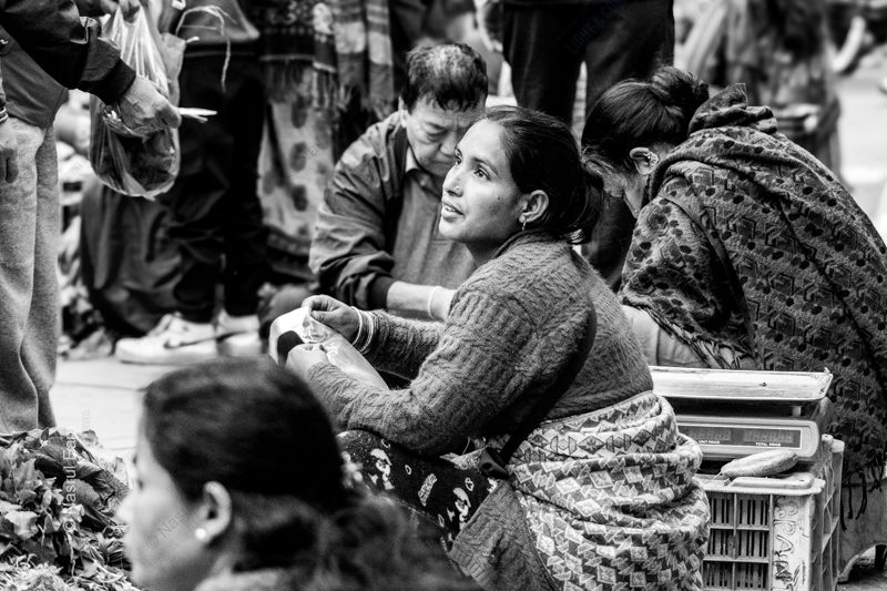 The Market Vendor's Upward Glance The Market Vendor's Upward Glance - Fine Art Photography Print, Limited Edition Photography, Museum-Quality Photography, Black and White Photography, Art Photography for Sale