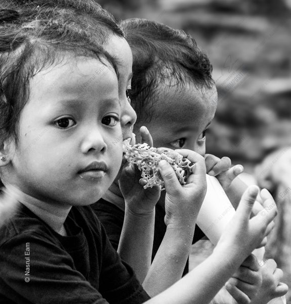 Three Young Faces, One Cracker Three Young Faces, One Cracker