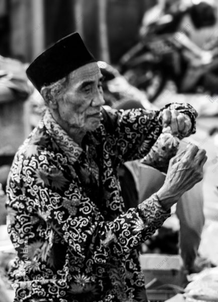 The Elder in the Batik Shirt