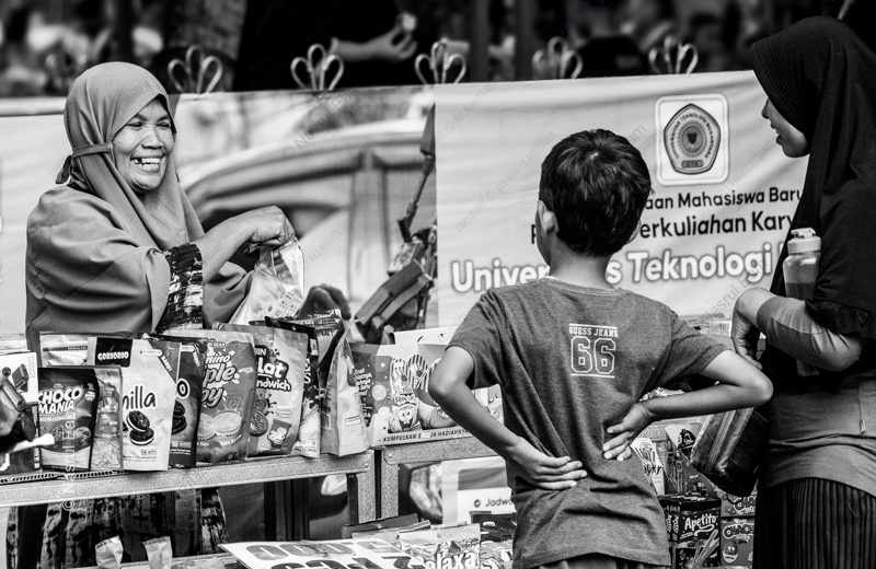 A Shared Smile at the Market Stall A Shared Smile at the Market Stall