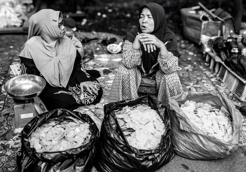 A Conversation Between Market Vendors