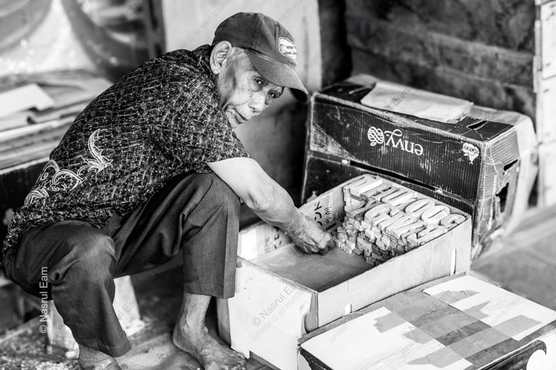 The Barefoot Craftsman with His Letters The Barefoot Craftsman with His Letters - Fine Art Photography Print, Limited Edition Print, Monochrome Photography, Art Photography, Photography Print