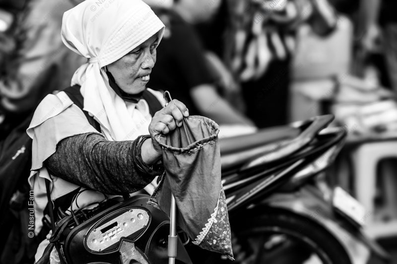 Woman with a Collection Pouch Woman with a Collection Pouch - Fine Art Photography Print, Black and White Photography, Documentary Photography, Limited Edition Print, Museum-Quality Photography