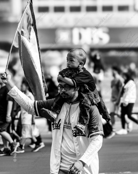 The Flag Bearer and His Son The Flag Bearer and His Son - Fine Art Photography Print, Limited Edition Print, Giclée Photography, Documentary Photography, Black and White Photography