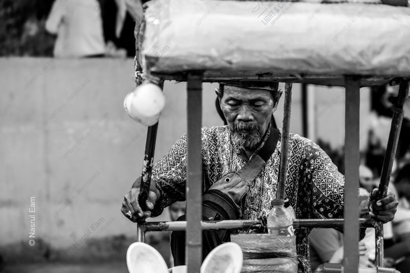 The Street Vendor in Repose Nasrul Eam