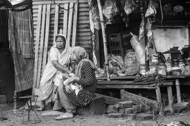 Women and Newborn at a Roadside Shop Women and Newborn at a Roadside Shop - Fine Art Photography Print, Limited Edition Photography, Giclée Print, Documentary Photography, Nasrul Eam