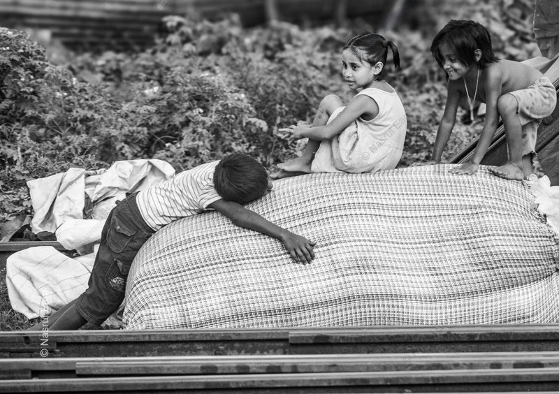 Children on a Bale by the Tracks