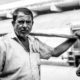 Man with a Carrying Beam - photography portrait, visual storytelling, black and white photography, light and composition, human dignity, documentary photography