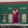 Woman at the Railway Wall - photography portrait, visual storytelling photography, photography composition, environmental portraiture, photography education, contemporary photography