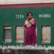 Woman at the Railway Wall - photography portrait, visual storytelling photography, photography composition, environmental portraiture, photography education, contemporary photography