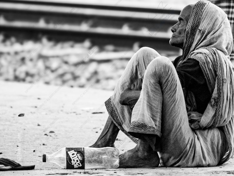 Woman Seated by the Railway Tracks nasrul eam 20250922 Dhaka Rajshahi Train EN1 0886
