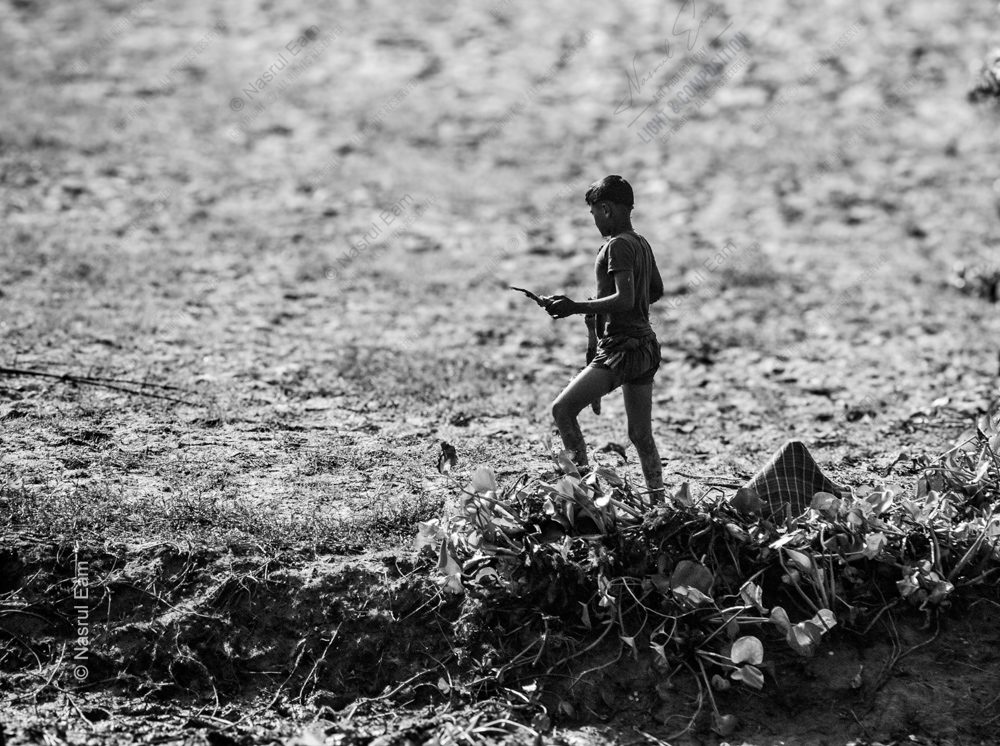 Boy on the Dry Riverbed