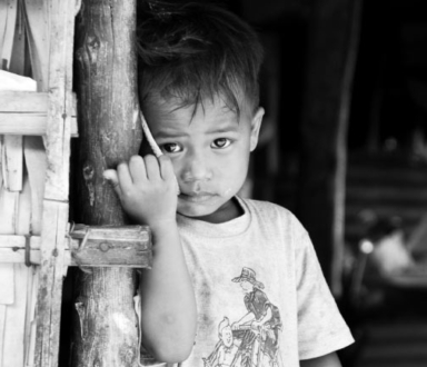 Shy Little Boy by Chhun Borin - Photojournalism, Portrait Photography, Award-Winning Photography, Photography Education, Light & Composition University