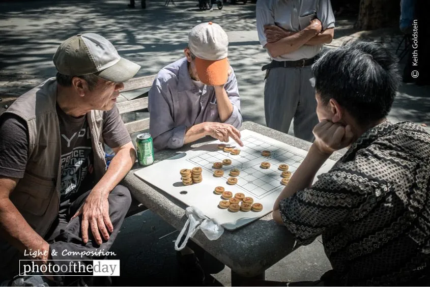 Men Playing Chinese Chess by Keith Goldstein